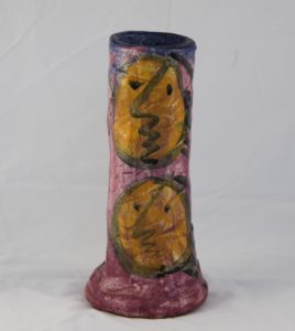 Deborah D Halpern “Pink cylindrical vessel with yellow faces”
